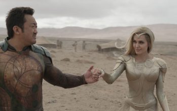 (L-R): Gilgamesh (Don Lee) and Thena (Angelina Jolie) in Marvel Studios' ETERNALS. Photo courtesy of Marvel Studios. ©Marvel Studios 2021. All Rights Reserved.